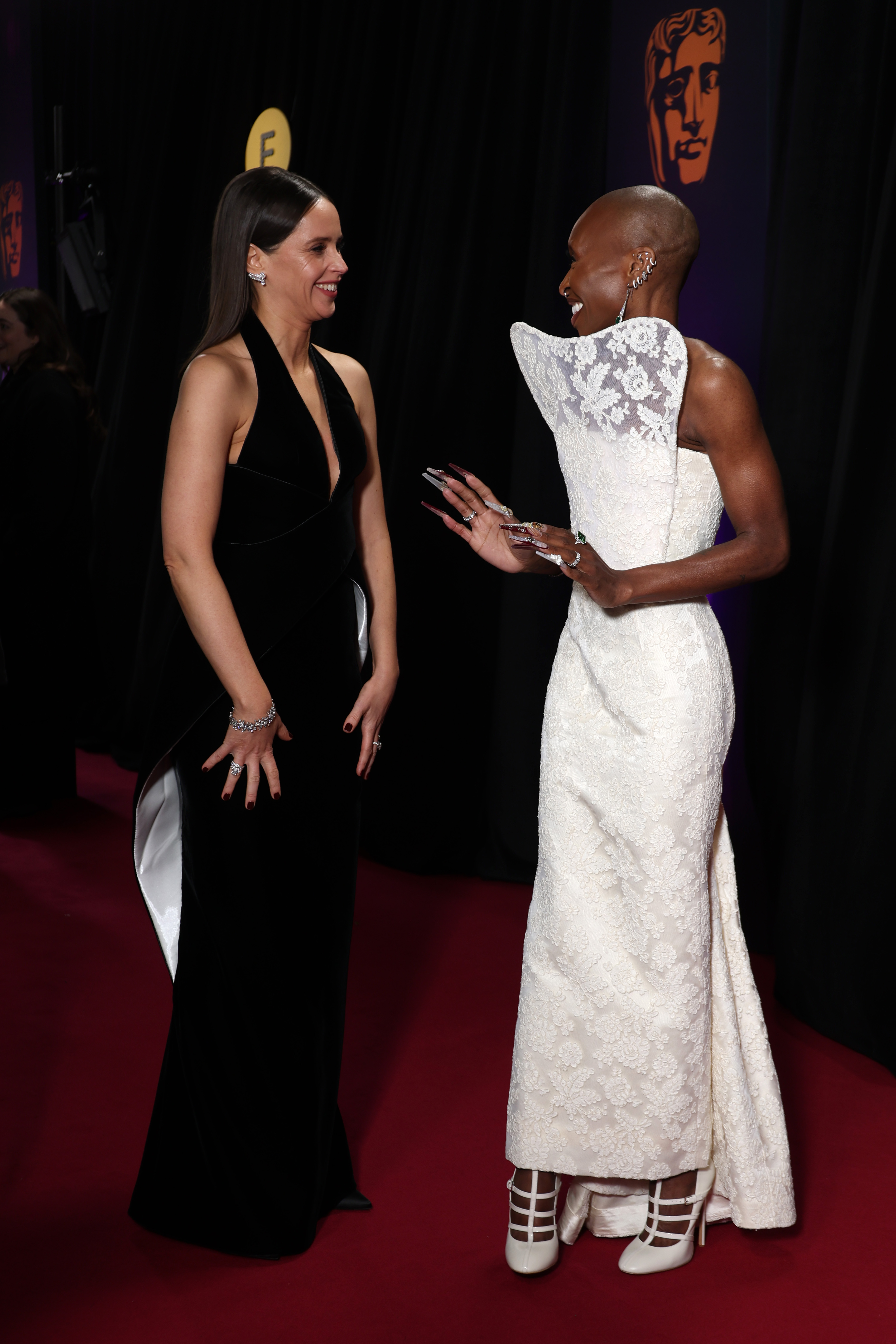LONDON, ENGLAND - FEBRUARY 16: Felicity Jones and Cynthia Erivo attend the 2025 EE BAFTA Film Awards at The Royal Festival Hall on February 16, 2025 in London, England. (Photo by Pascal Le Segretain/Getty Images)