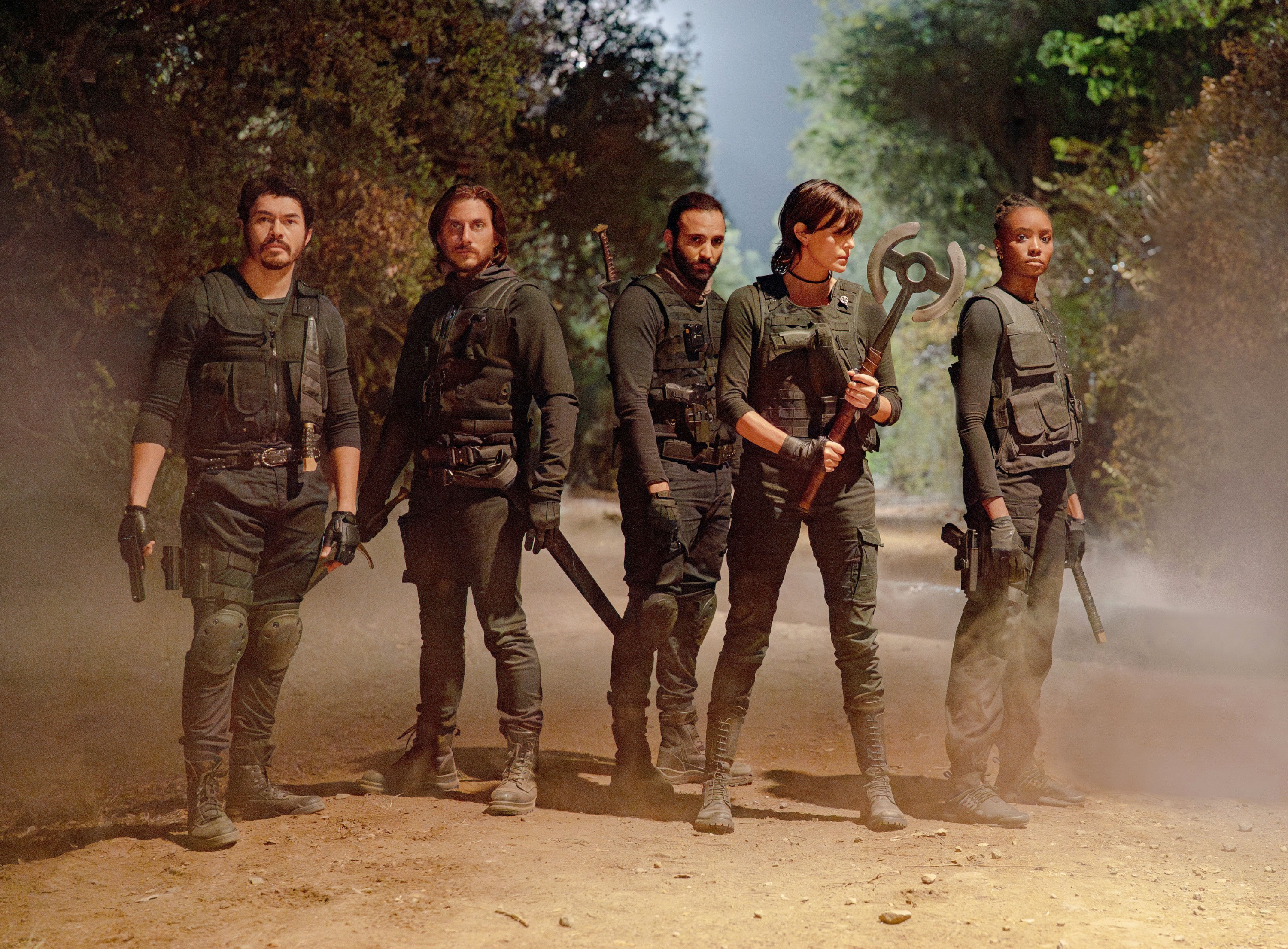 THE OLD GUARD 2, from left: Henry Golding, Luca Marinelli, Marwan Kenzari, Charlize Theron, KiKi Layne, 2025. ph: Eli Joshua Ade / © Netflix / courtesy Everett Collection