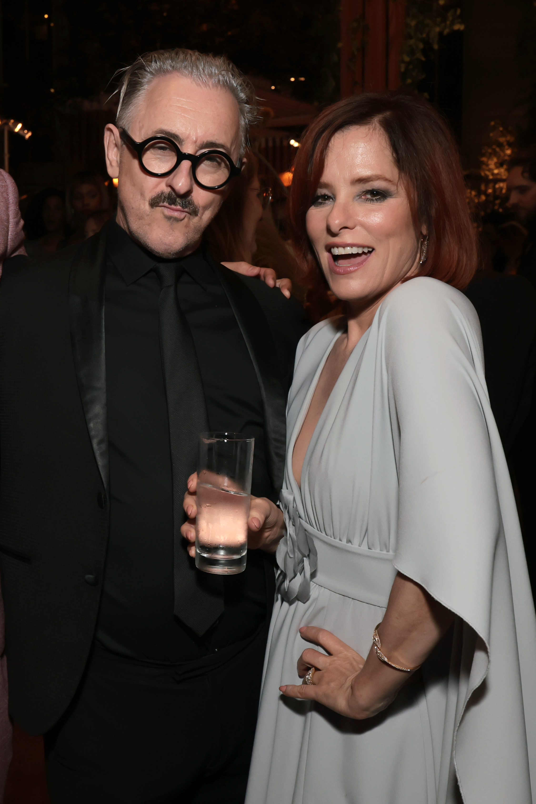 LOS ANGELES, CALIFORNIA - SEPTEMBER 13: (L-R) Alan Cumming and Parker Posey attend MPTF's 19th Annual Evening Before at Century Park on September 13, 2025 in Los Angeles, California. (Photo by Kevin Mazur/Getty Images for MPTF)