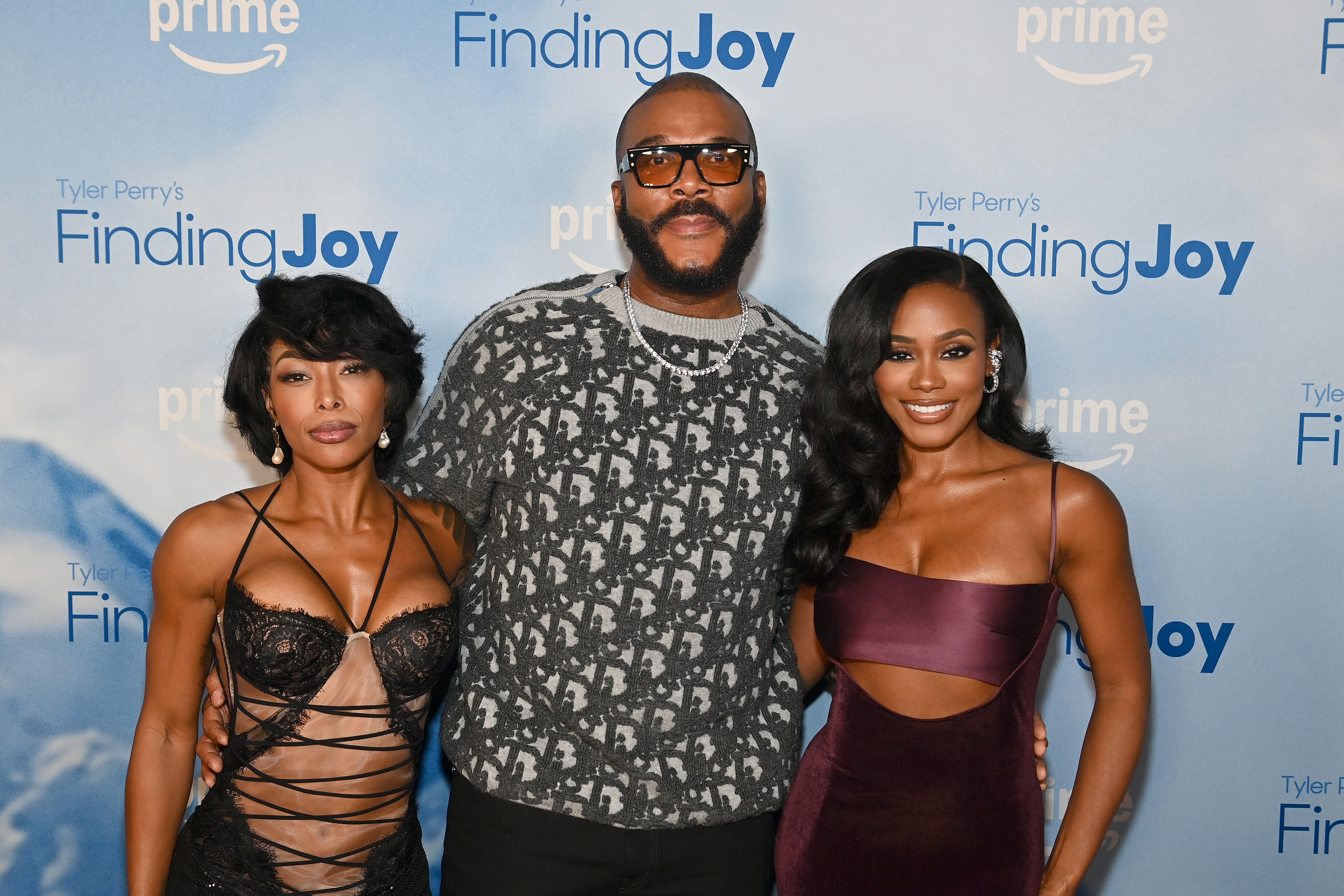 ATLANTA, GEORGIA - NOVEMBER 02: (L-R) Brittany S. Hall, Tyler Perry and Shannon Thornton attend the Tyler Perry's Finding Joy Atlanta screening at Regal Atlantic Station on November 02, 2025 in Atlanta, Georgia. (Photo by Paras Griffin/Getty Images for Amazon)