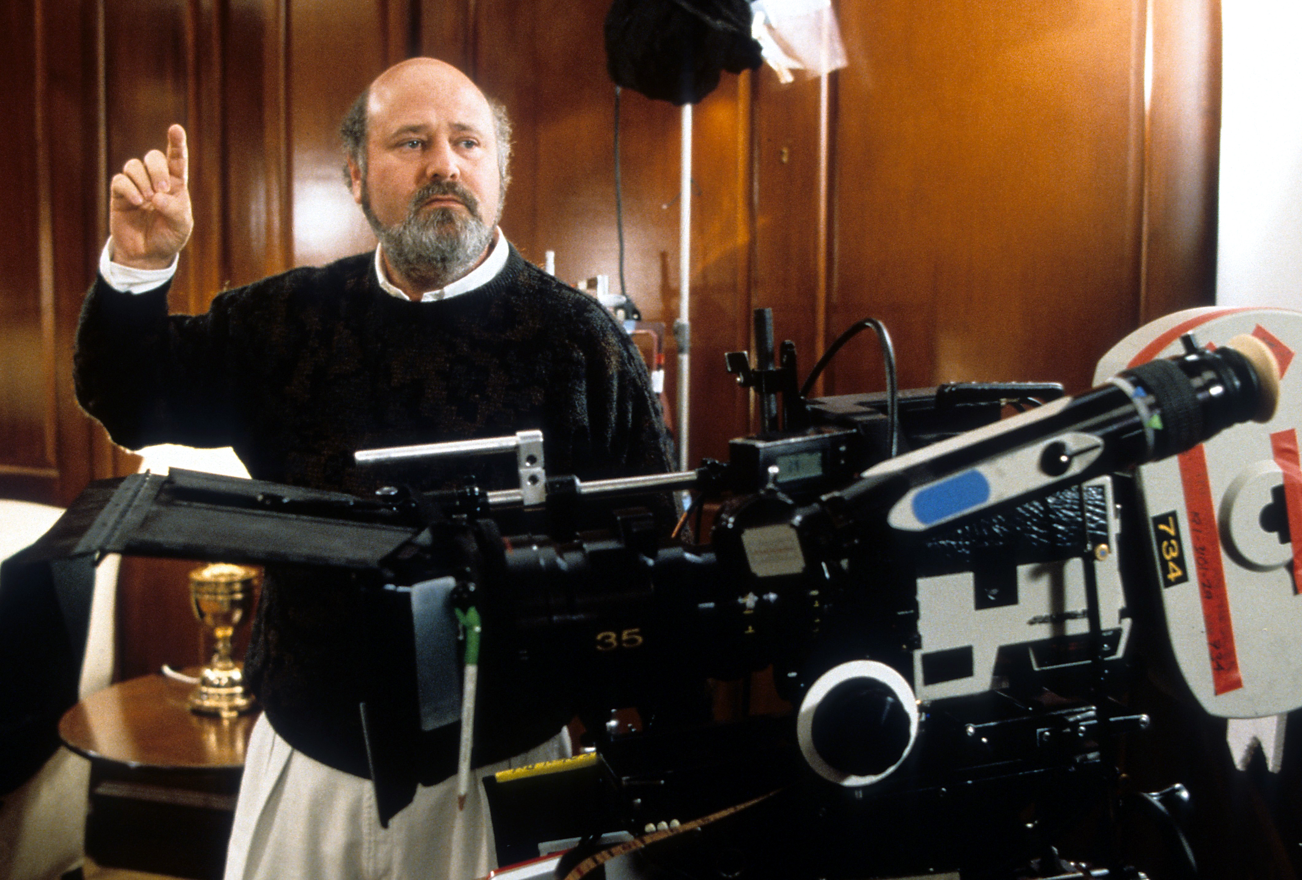 Director Rob Reiner providing instruction in between scenes from the film 'The American President', 1995. (Photo by Universal/Getty Images)