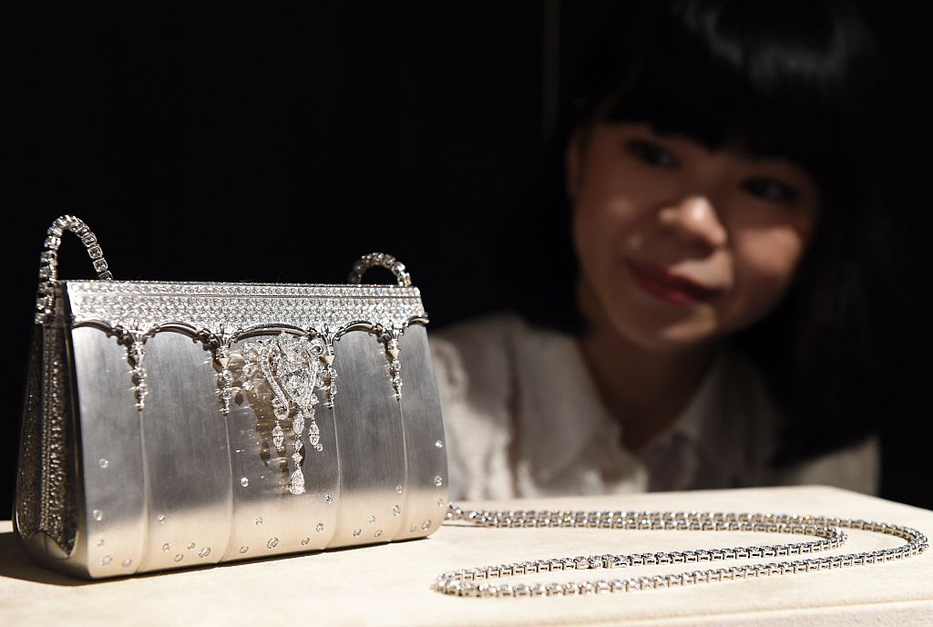 most expensive purses in the world, A Ginza Tanaka employee shows off 200-million-yen (1,626,016 USD) diamond bijou bag made of 208ct, 2182-diamonds and platinum during a platinum exhibition press preview in Tokyo on June 18, 2015. Japan's jewelry company, Ginza Tanaka will hold the exhibition, "The Story of Platinum" together with Platinum Guild International from June 19 to July 31.          AFP PHOTO / TOSHIFUMI KITAMURA        (Photo credit should read TOSHIFUMI KITAMURA/AFP via Getty Images)