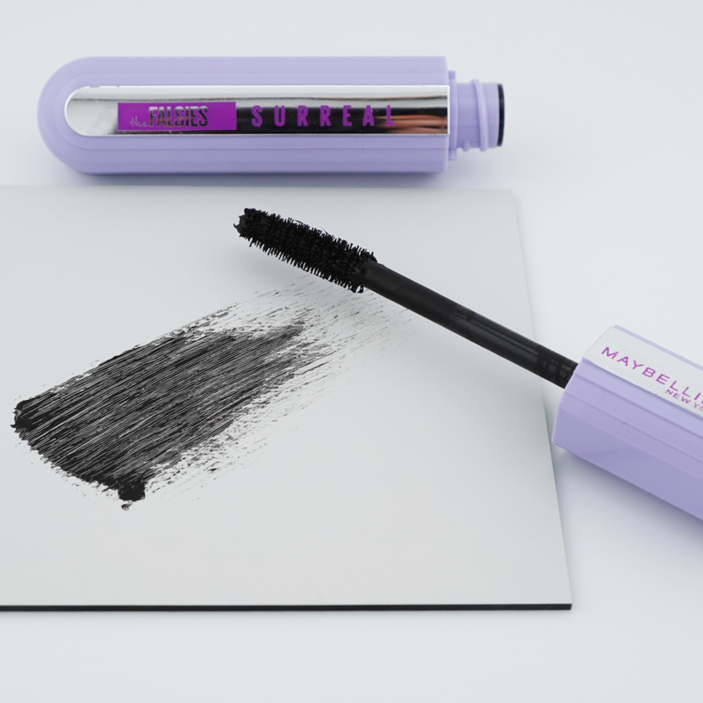 purple mascara tube with product swatch