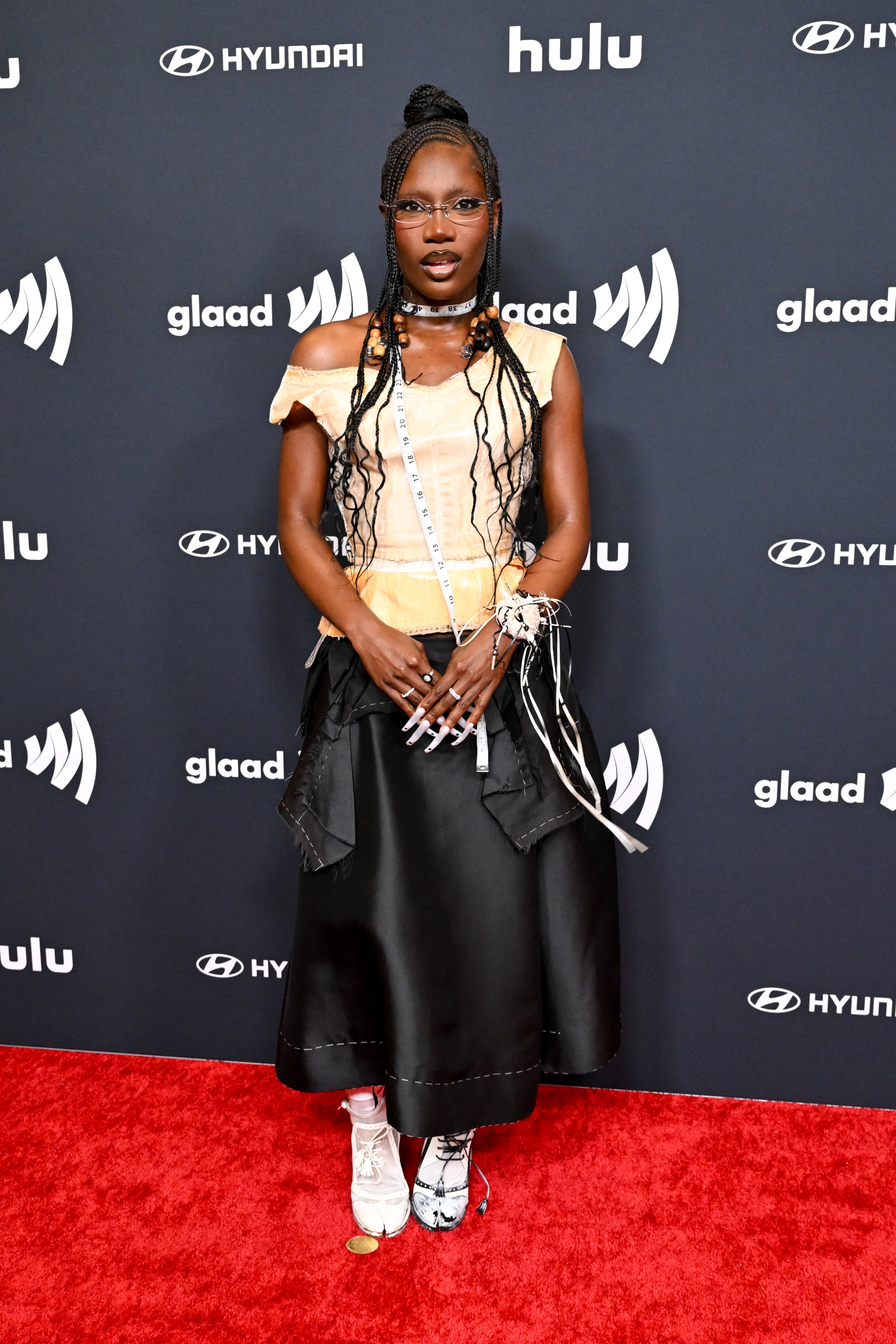 Doechii attends the GLAAD Media Awards wearing Maison Margiela.