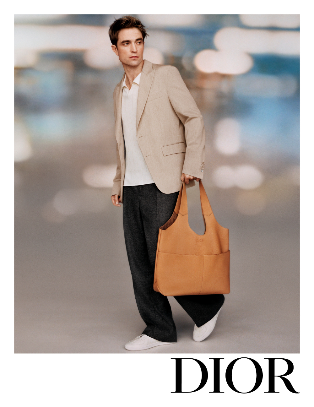 Robert Pattinson with a Dior Privé bag