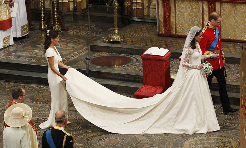 LONDON, ENGLAND - APRIL 29:  Prince William, Duke of Cambridge, his new bride Catherine, Duchess of Cambridge and Pippa Middleton (L) take part in the service on April 29, 2011 in London, England. The marriage of the second in line to the British throne is to be led by the Archbishop of Canterbury and will be attended by 1900 guests, including foreign Royal family members and heads of state. Thousands of well-wishers from around the world have also flocked to London to witness the spectacle and pageantry of the Royal Wedding. (Photo by Kirsty Wigglesworth  - WPA Pool/Getty Images)