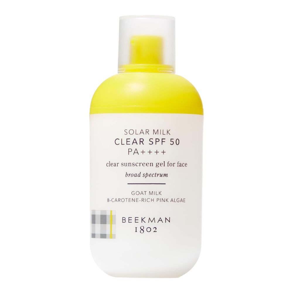 yellow and white bottle of face sunscreen