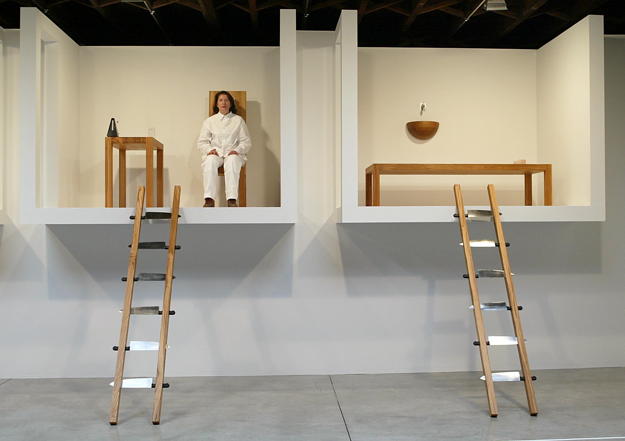 NEW YORK, UNITED STATES: Artist Marina Abramovic sits in her exhibition called