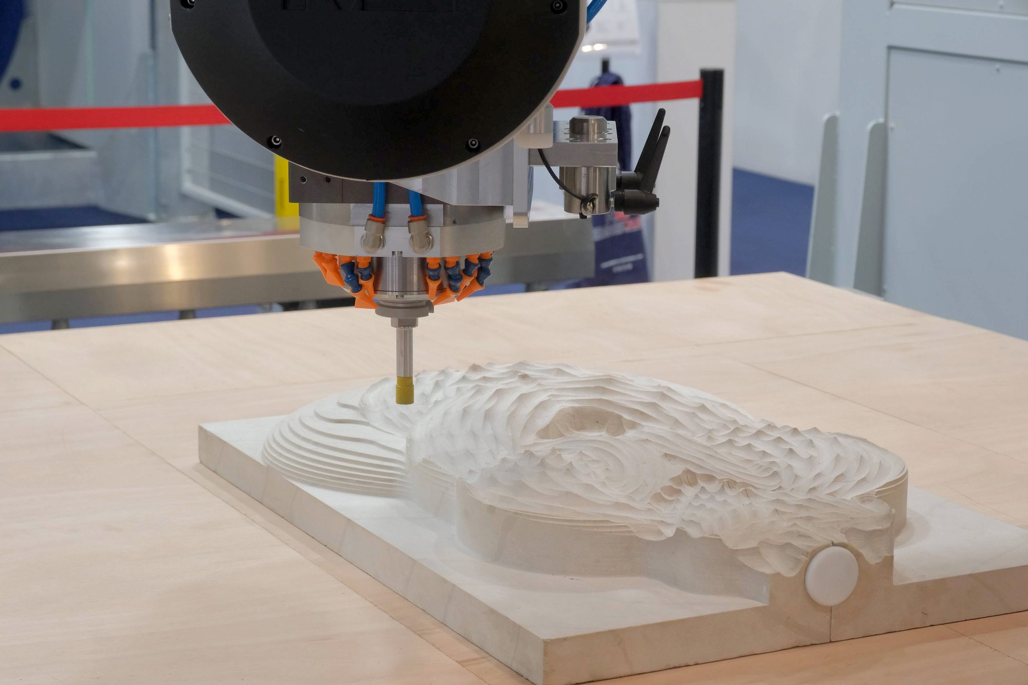 Fine stone is chiseled by new machinery.