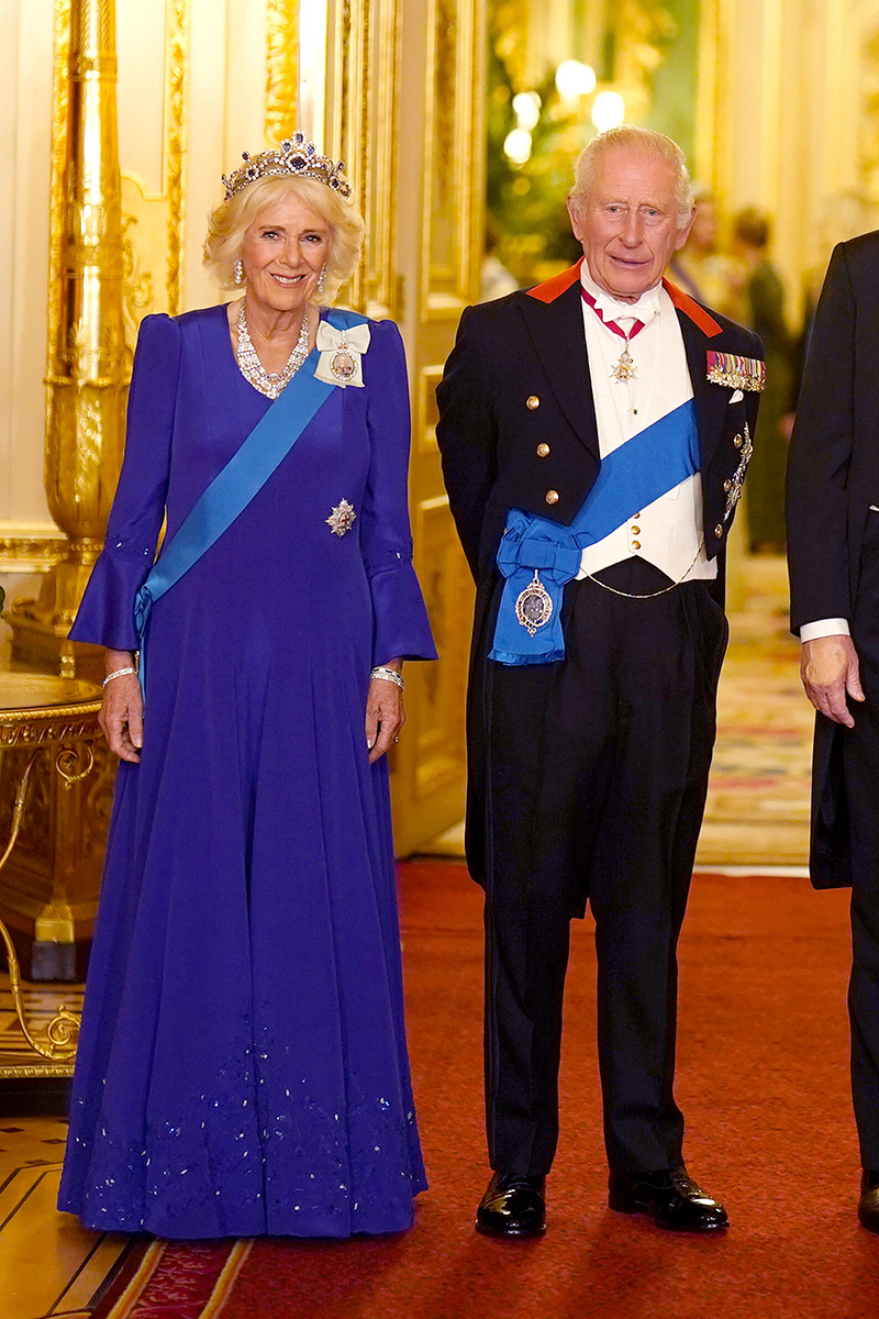 Queen Camilla wears a Fiona Clare gown with Queen Elizabeth II's sapphire and diamond tiara for the State Banquet hosted by King Charles III and members of the Royal Family at Windsor Castle during the state visit by the President of the United States of America on Sept. 17, 2025 in Windsor, England.