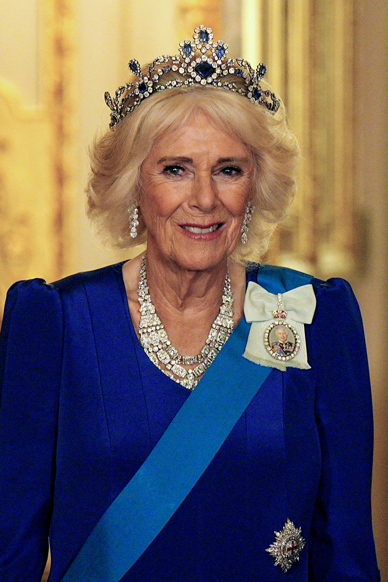 Queen Camilla wears a Fiona Clare gown with Queen Elizabeth II's sapphire and diamond tiara for the State Banquet hosted by King Charles III and members of the Royal Family at Windsor Castle during the state visit by the President of the United States of America on Sept. 17, 2025 in Windsor, England.