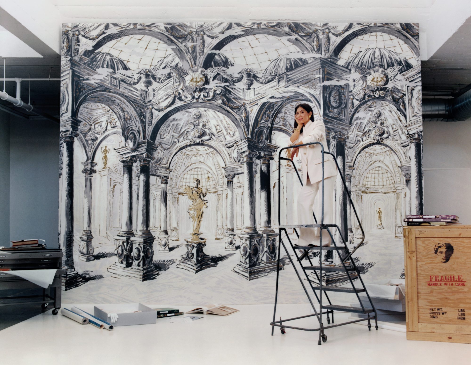 Nathalie Ebel poses in front of Palazzo Panel Set inspired by Schumacher Archives