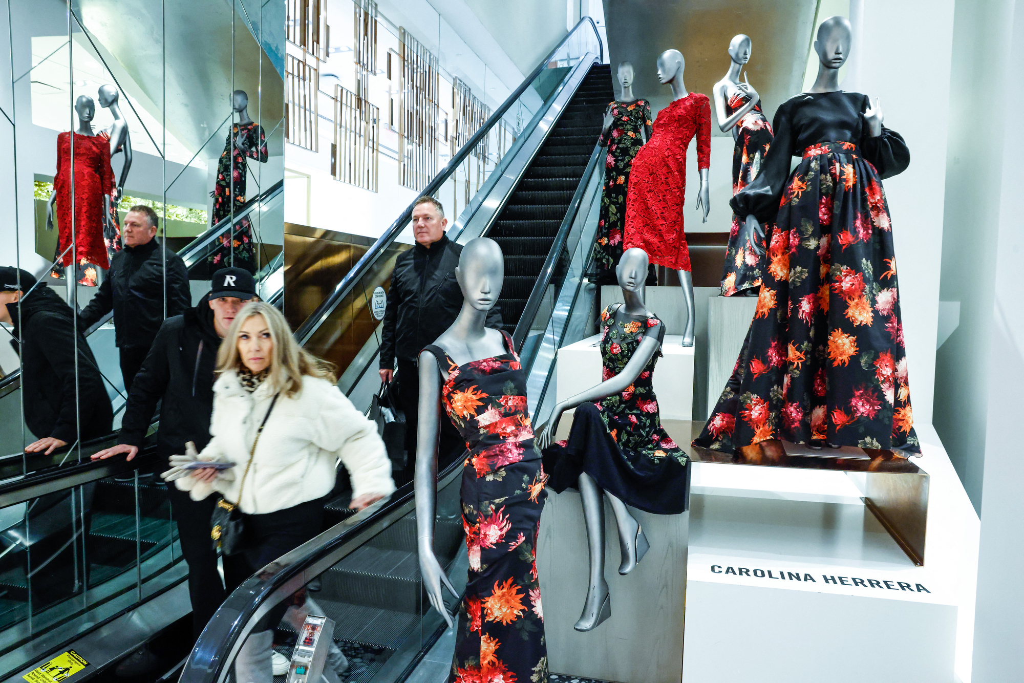 Costumers ride an escalator during Black Friday deals inside Saks Fifth Avenue Store in New York City, on November 28, 2025. A record $5 billion is expected to be spent per day over the 10 days that begins on