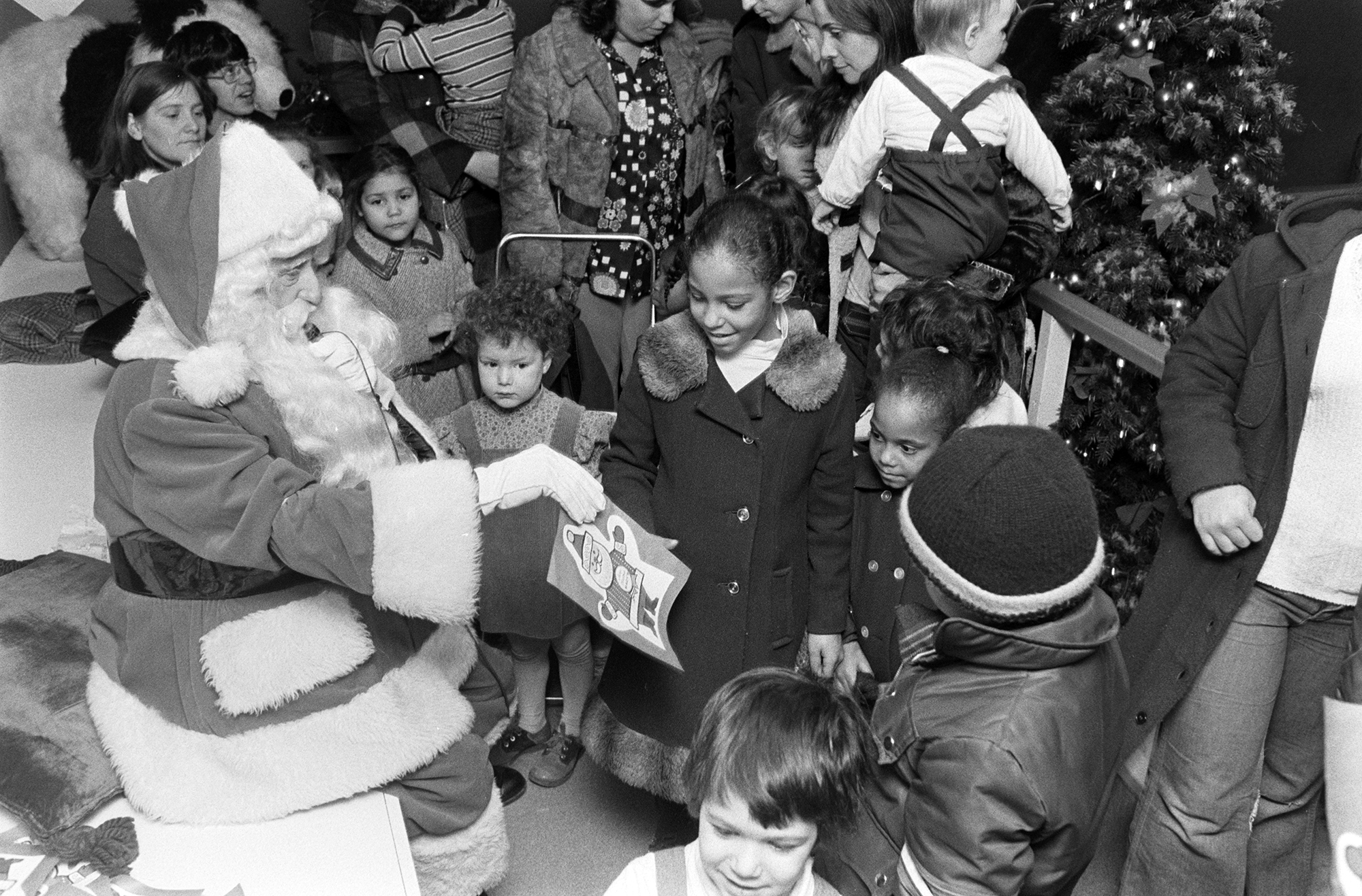 Kids visit Santa at Macy's Santaland Village, New York.