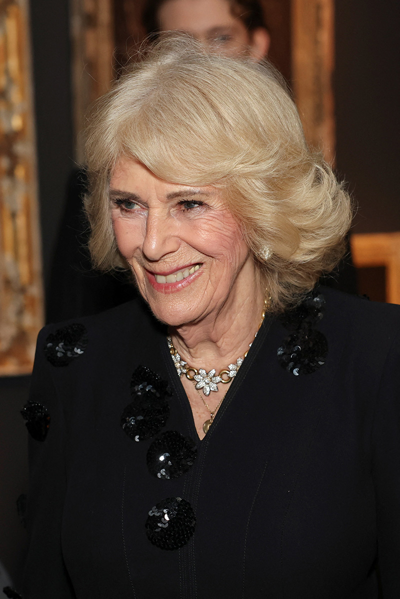 Queen Camilla wears Anna Valentine at a special screening of