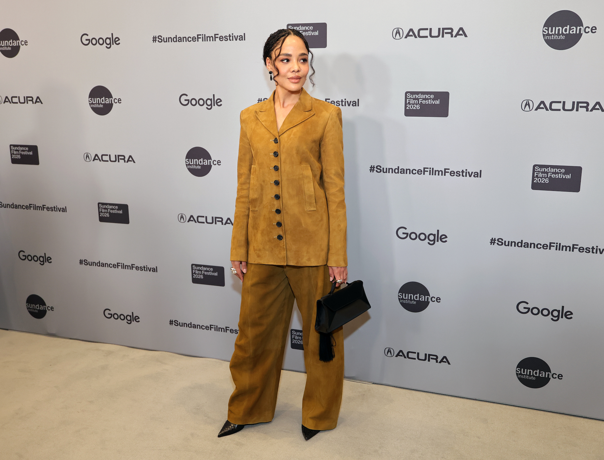 Tessa Thompson wearing a suede Khaite ensemble as she attends Celebrating Sundance Institute: A Tribute To Founder Robert Redford during the 2026 Sundance Film Festival on Friday in Park City, Utah. Tessa Thompson style, Sundance style, suede jacket