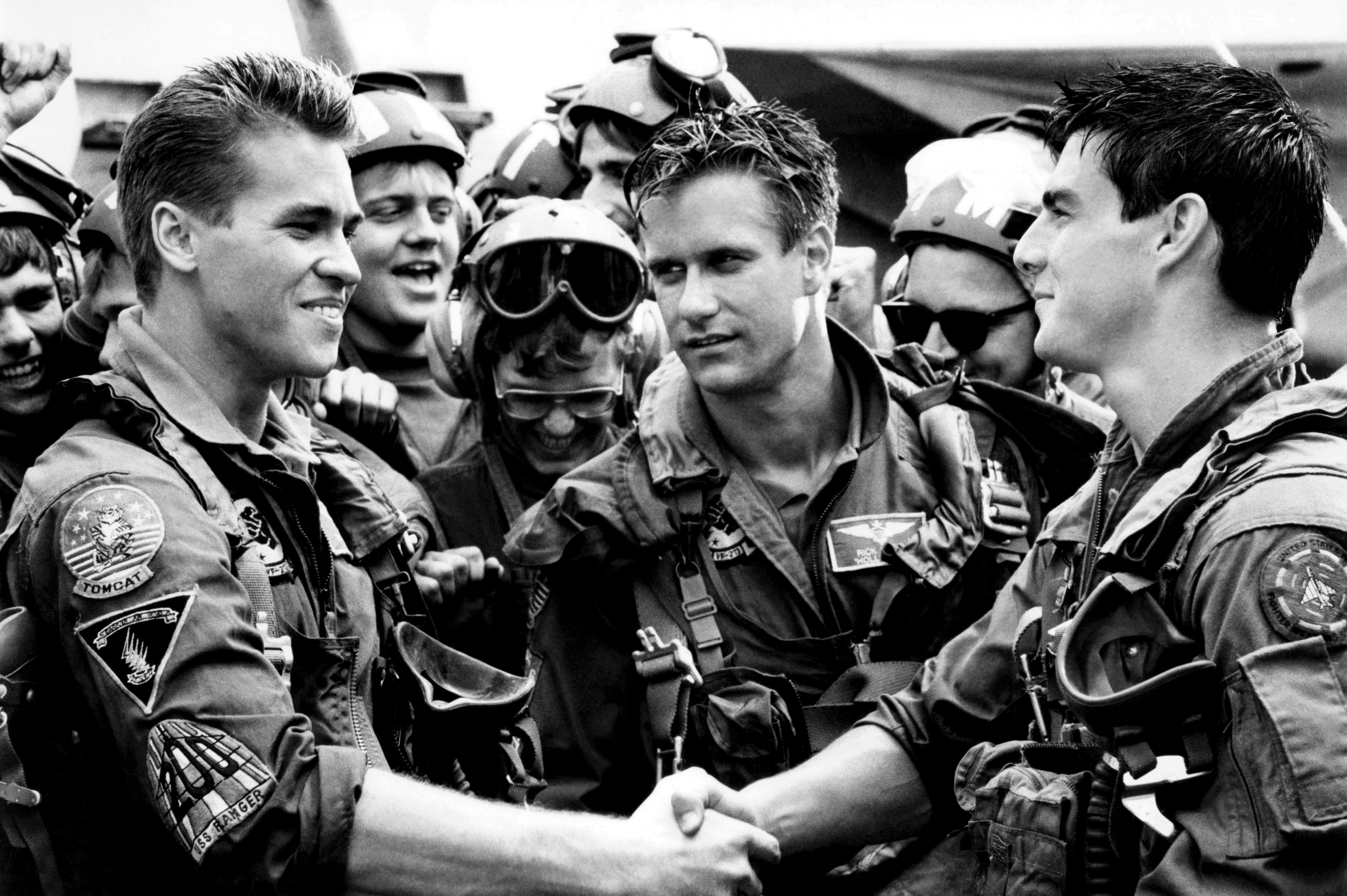 TOP GUN, from left, Val Kilmer, Barry Tubb, Tom Cruise, 1986, ©Paramount/courtesy Everett Collection