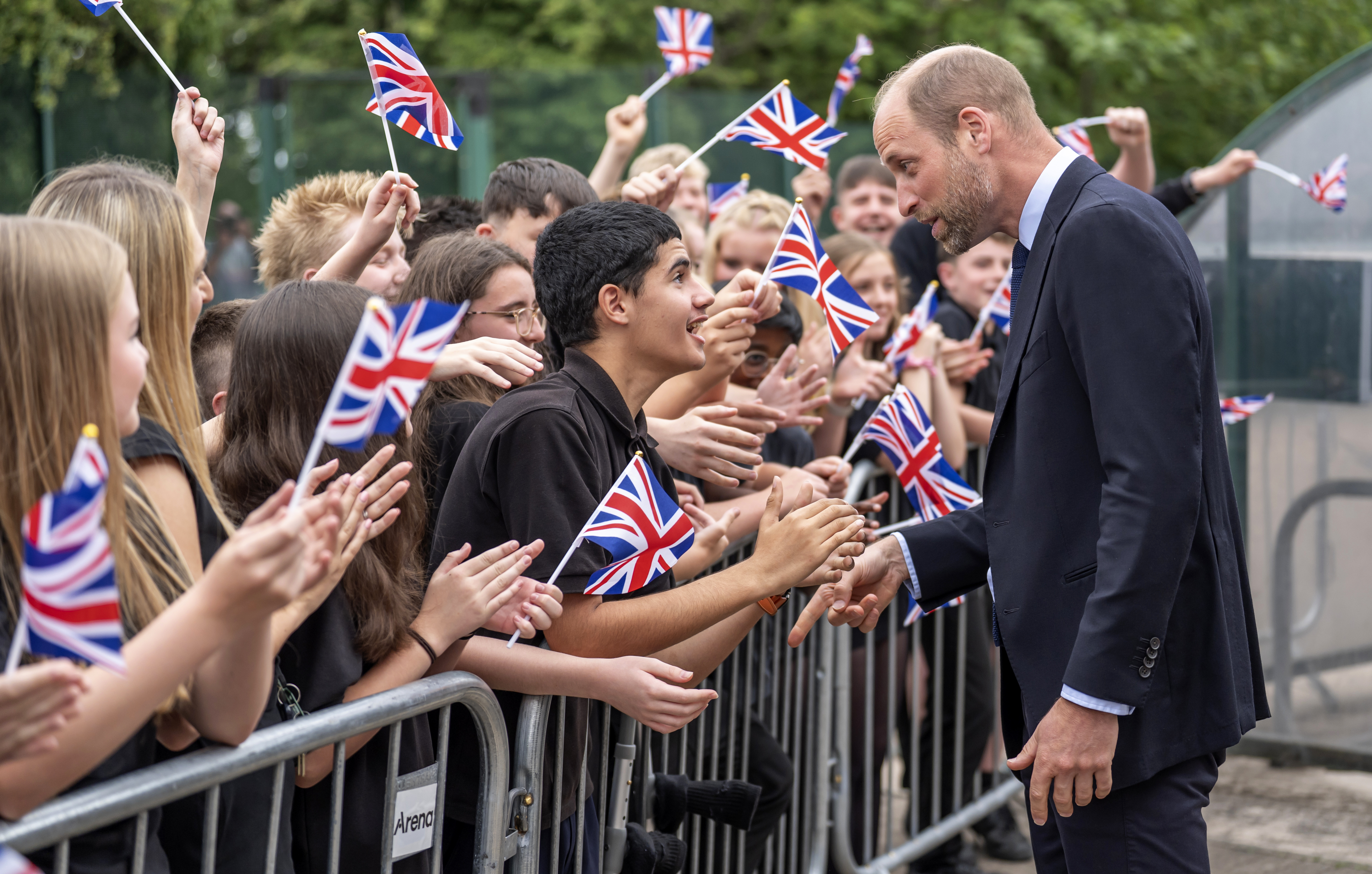 SHEFFIELD, ENGLAND - JULY 1: Prince William, Prince of Wales meets pupils during a visit to Meadowhead Secondary School in Sheffield, as part of his visit to the city to mark the two-year anniversary of the Homewards Programme on July 01, 2025 in Sheffield, England. For the past two years, Royal Foundation's Homewards programme has set out to demonstrate ways to end homelessness. (Photo by Danny Lawson-WPA Pool/Getty Images)