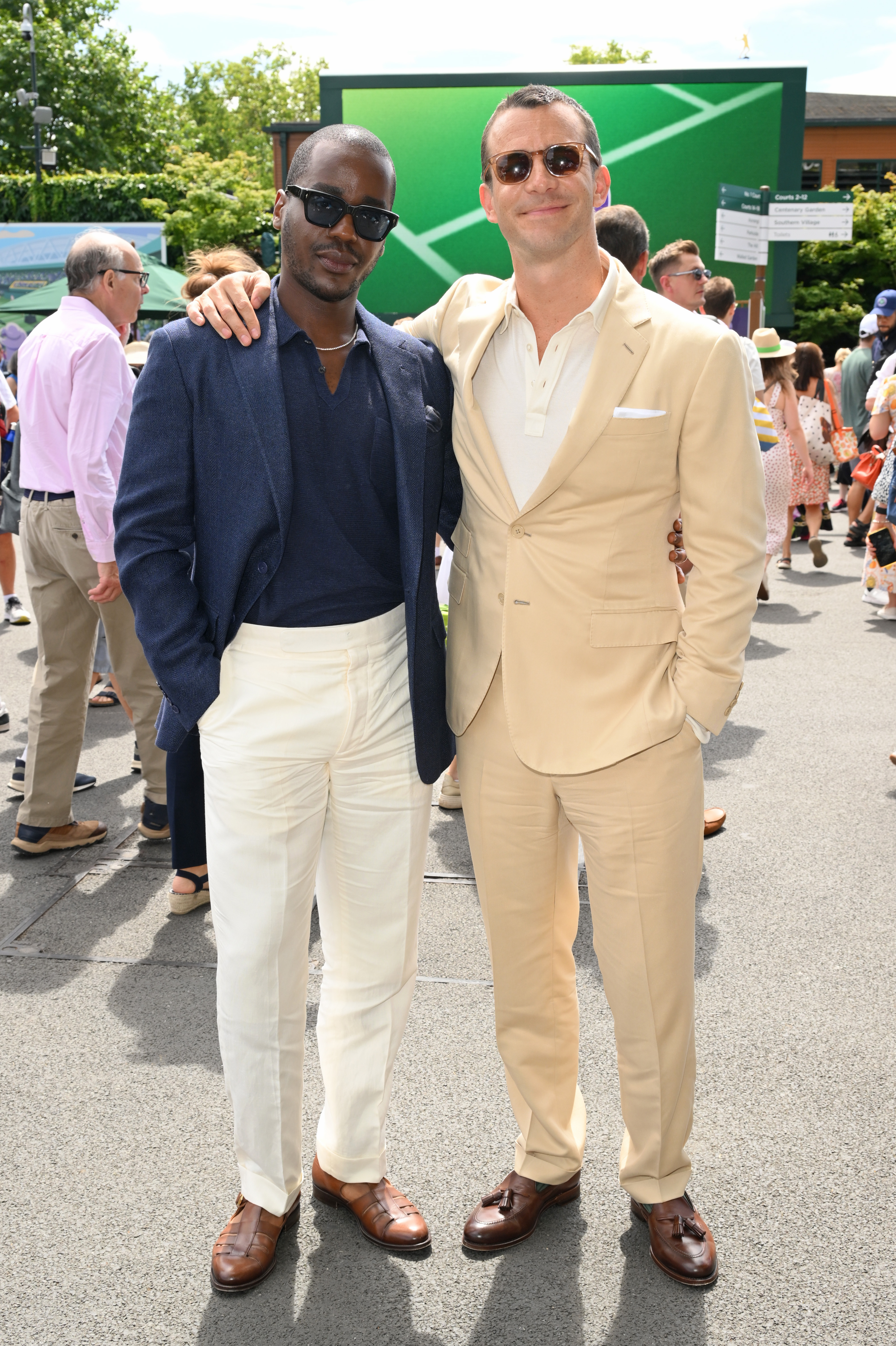 LONDON, ENGLAND - JULY 09: Ncuti Gatwa and Luke Thompson, wearing Ralph Lauren, attend day ten of the Wimbledon Tennis Championships at the All England Tennis and Croquet Club at on July 09, 2025 in London, England. (Photo by Karwai Tang/Getty Images for Ralph Lauren)