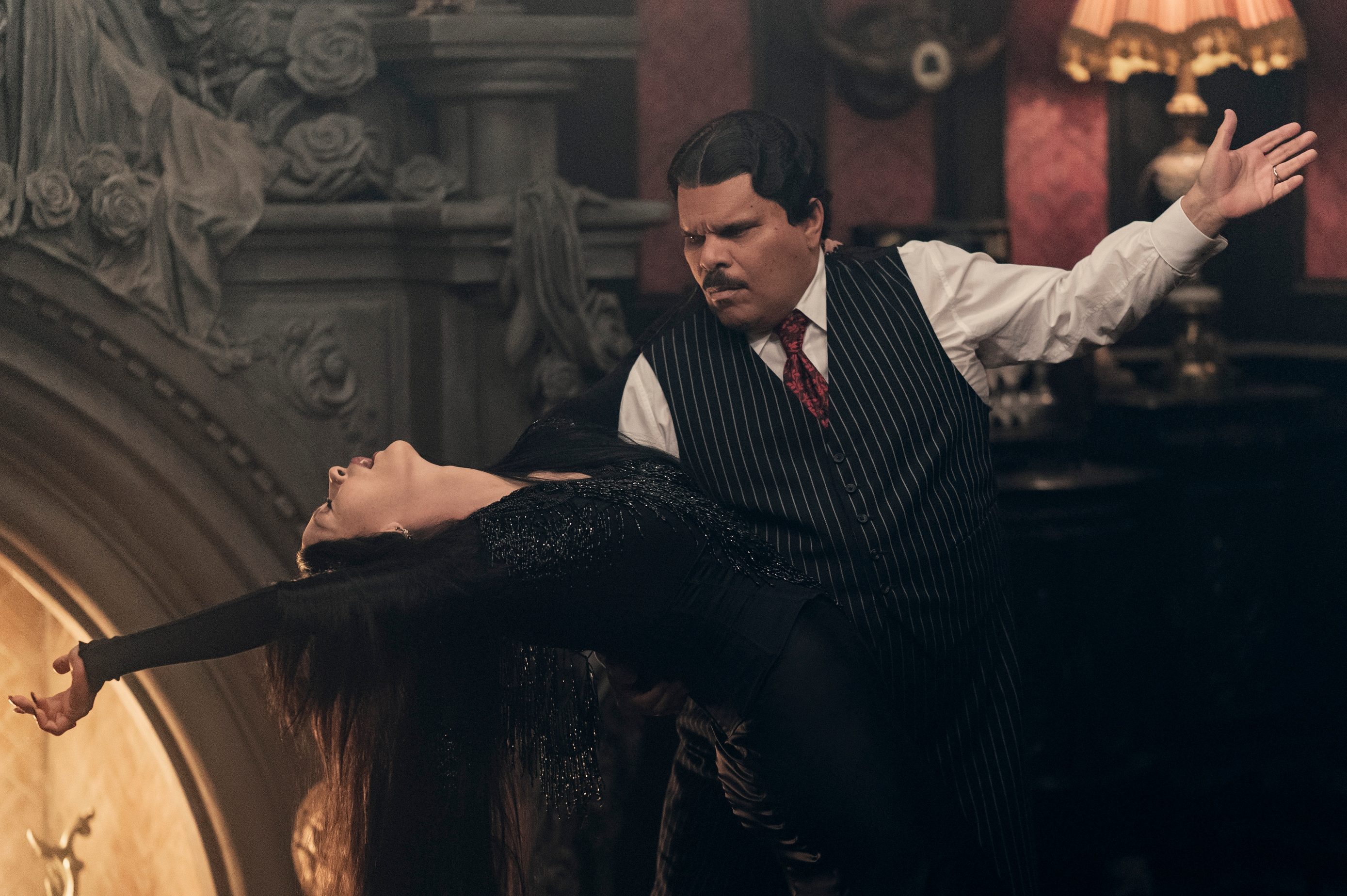 Wednesday. (L to R) Catherine Zeta-Jones as Morticia Addams, Luis Guzmán as Gomez Addams in episode 203 of Wednesday. Cr. Jonathan Hession/Netflix © 2025