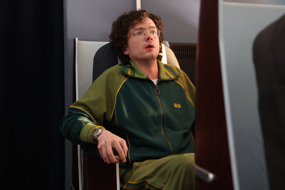SATURDAY NIGHT LIVE -- Episode 1884 -- Pictured: Martin Herlihy during the PDD: First Class sketch on Saturday, May 17, 2025 -- (Photo by: Holland Rainwater/NBC)