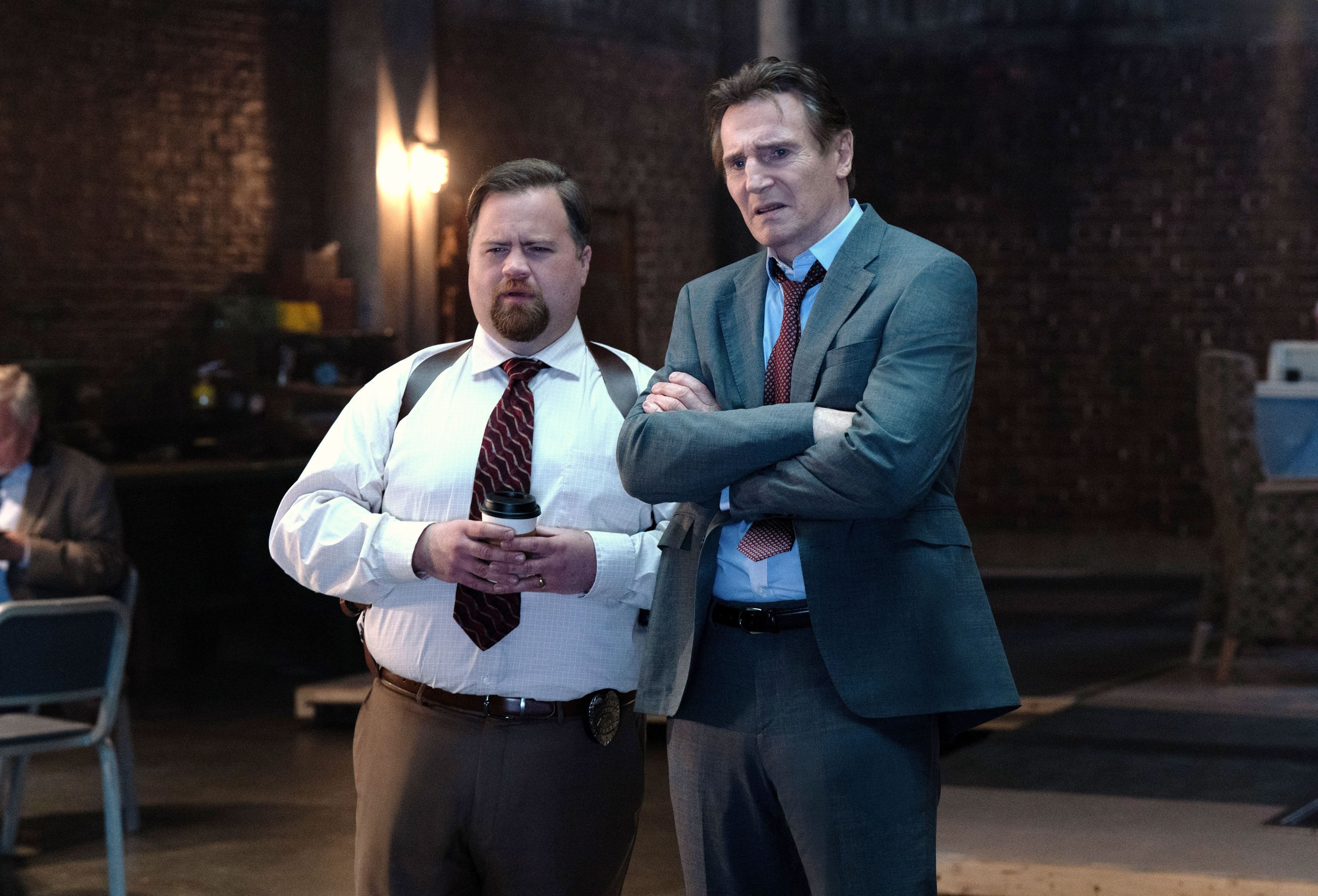 THE NAKED GUN, from left: Paul Walter Hauser, Liam Neeson, 2025. ph: Frank Masi /© Paramount Pictures /Courtesy Everett Collection