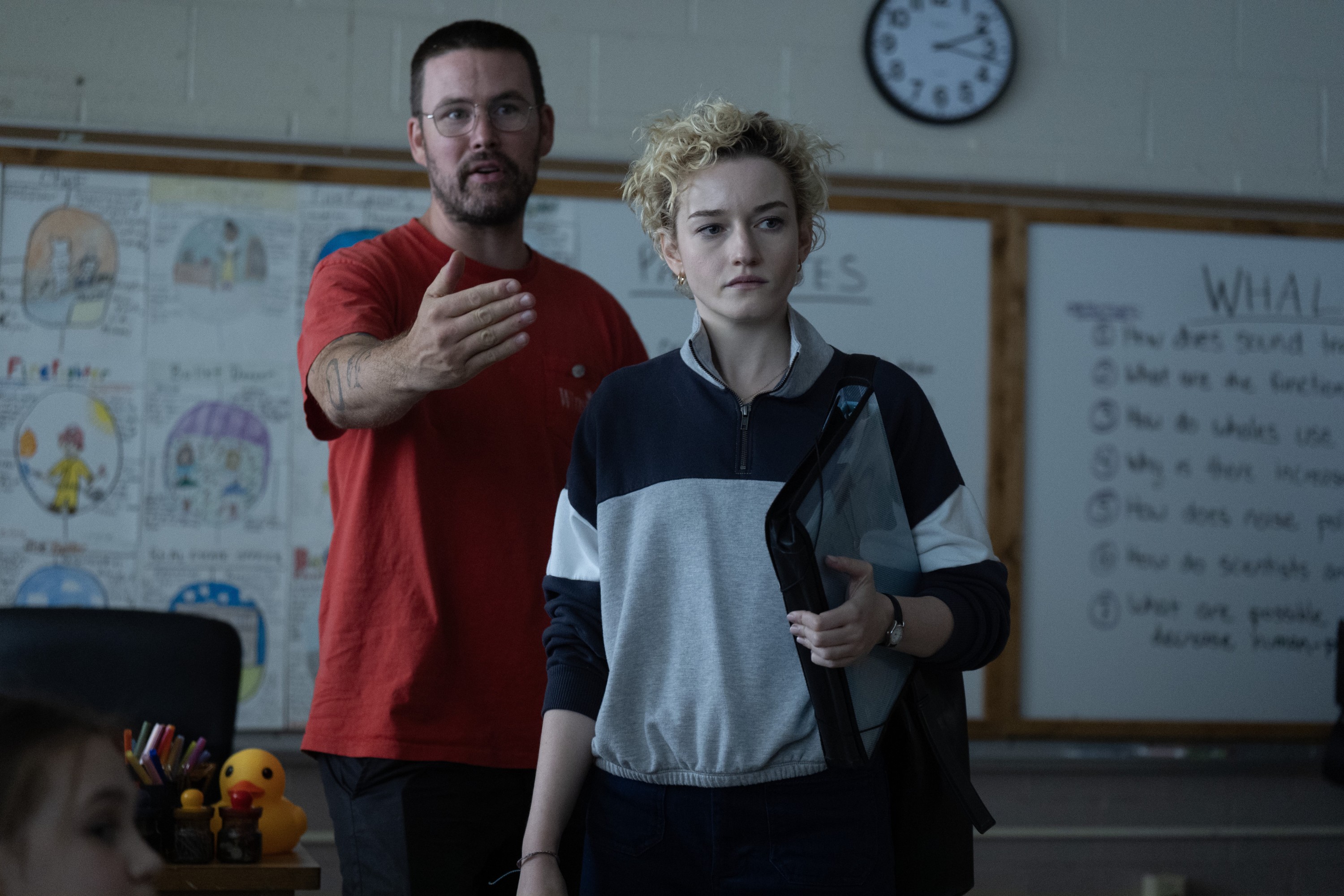 WEAPONS, from left: director Zach Cregger, Julia Garner, on set, 2025. ph: Quantrell Colbert / © Warner Bros. / Courtesy Everett Collection
