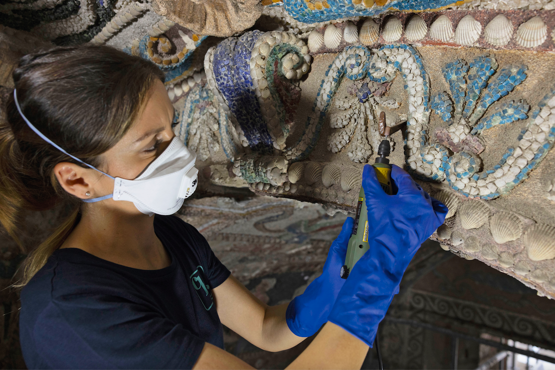 An artisan at work to restore the Grotto of Diana at Villa d'Este.