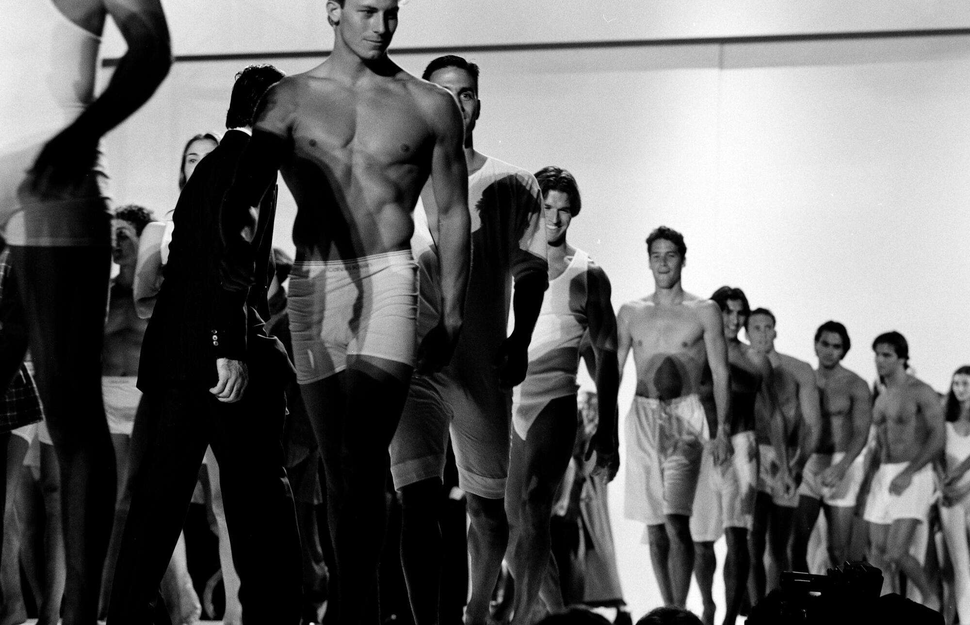 Models walk the runway during a benefit event at the Hollywood Bowl in Hollywood, California, on June 4, 1993.