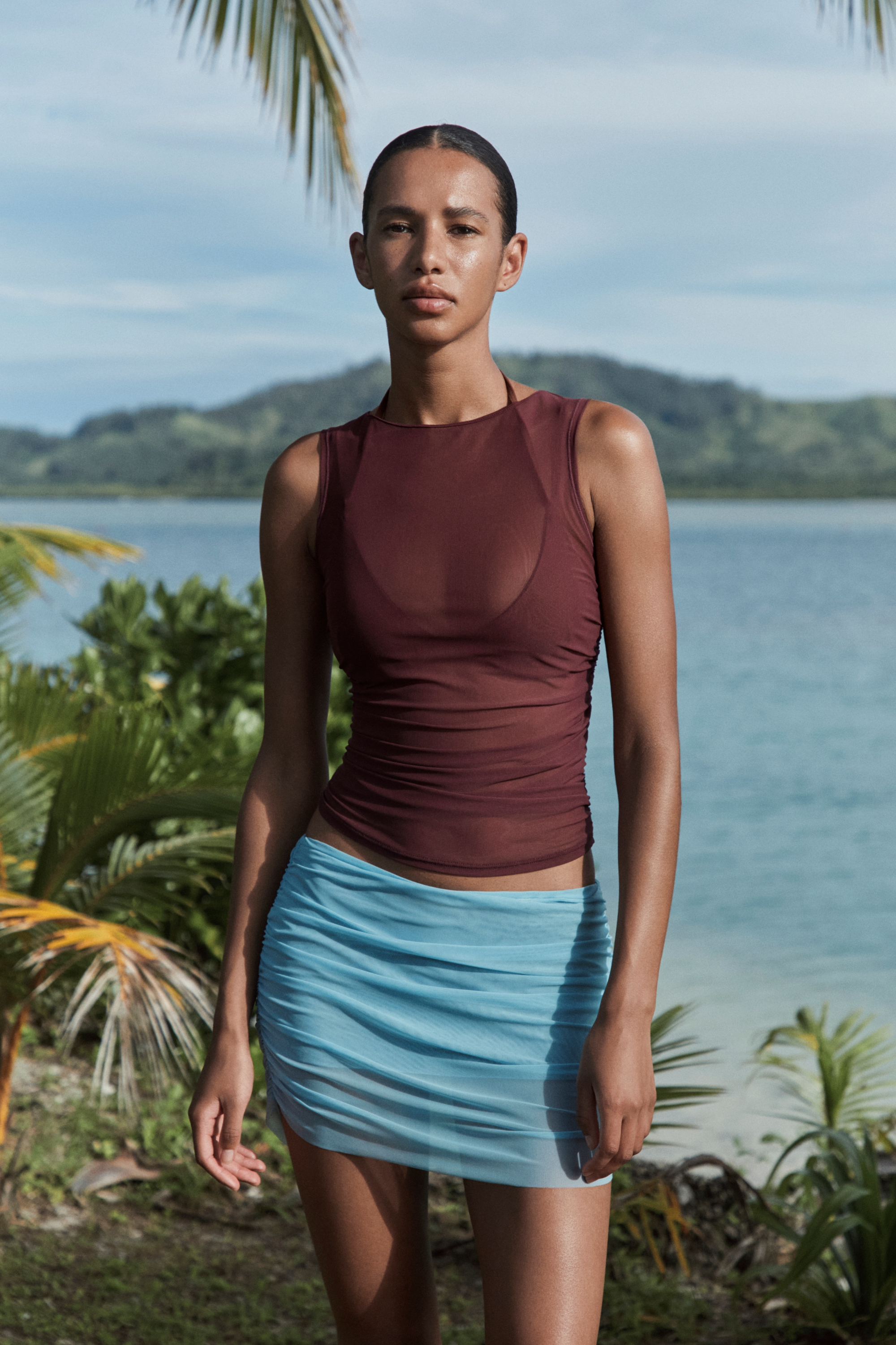 model in sheer top and skirt from Bond-eye.