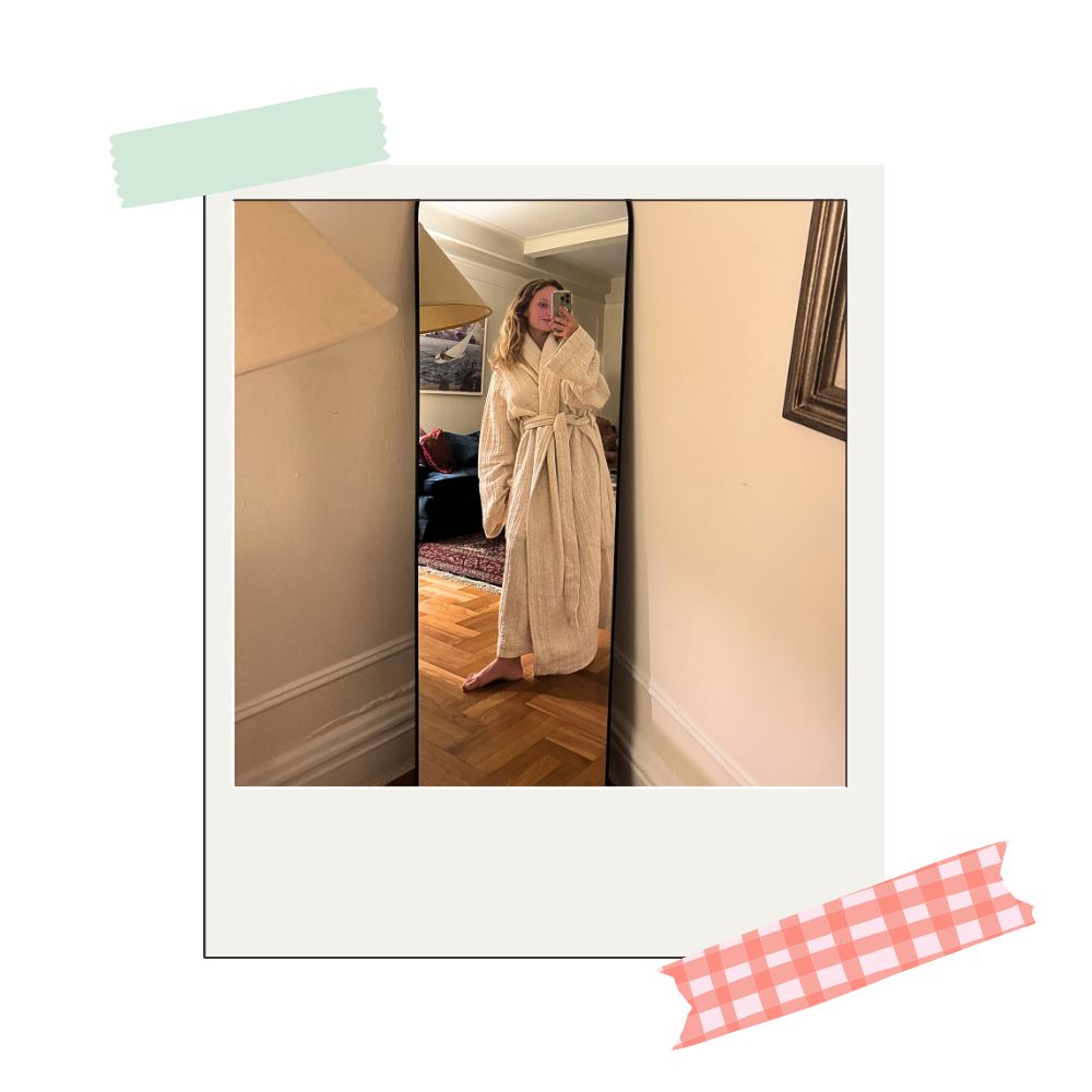 writer testing out parachute's cozy knit robe in a light color