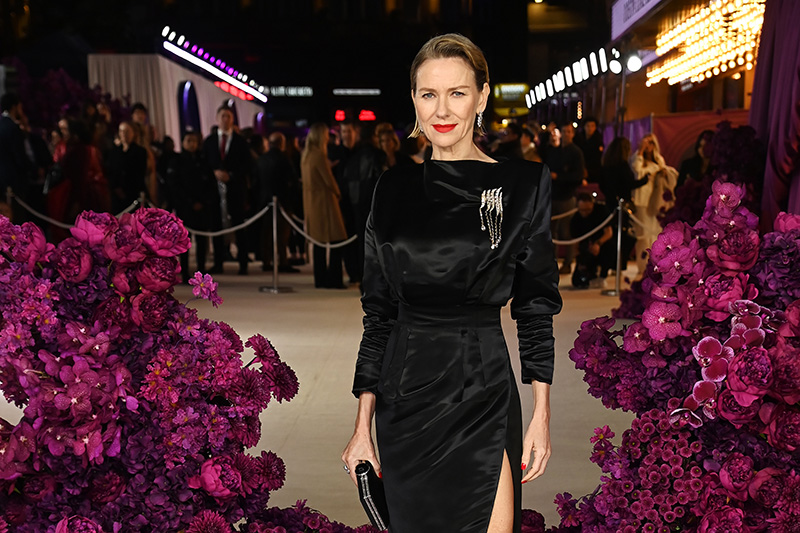Naomi Watts carries the Judith Leiber Skylar Satin Black Clutch at the "All's Fair" premiere on Oct. 22, 2025 in London.