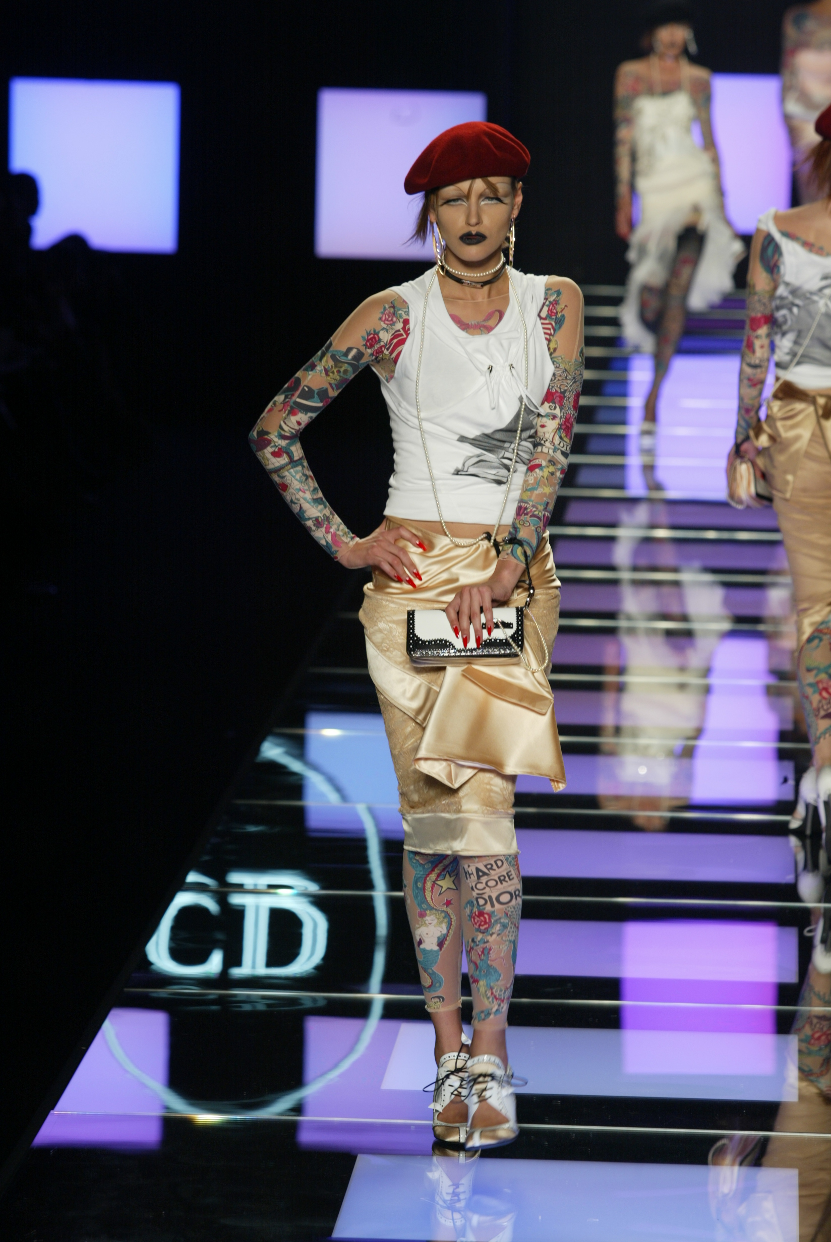 A model walks down the runway at the Spring 2004 Christian Dior show in Paris.